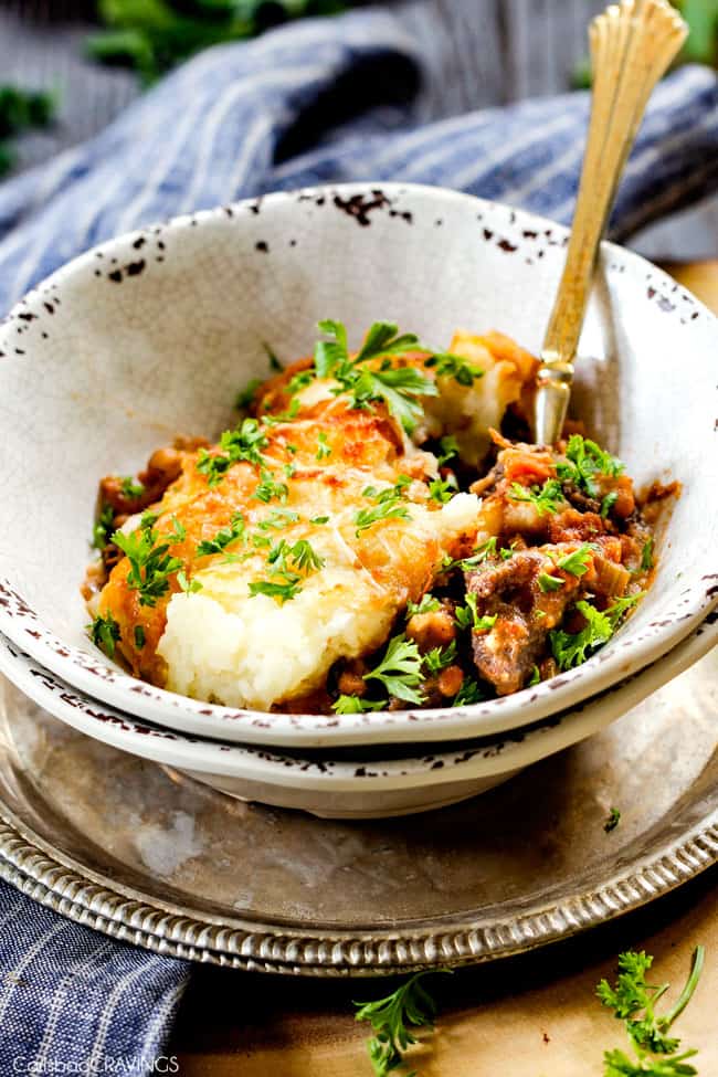 a bowl of the ultimate Shepherd's Pie made with short ribs or ground beef, carrots, celery, mashed potatoes 