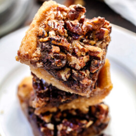 Easy ONE BOWL Chocolate Chunk Pecan Bars with a SUGAR COOKIE CRUST! these bars are AMAZING! Way better with chocolate chunks and the Sugar Cookie Crust is so soft and chewy.