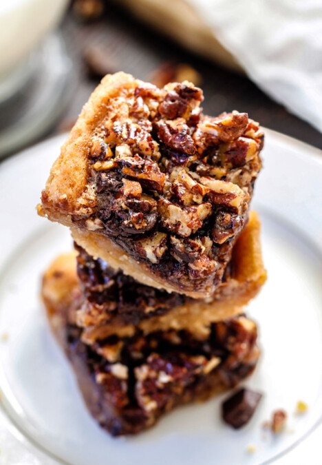 Easy ONE BOWL Chocolate Chunk Pecan Bars with a SUGAR COOKIE CRUST! these bars are AMAZING! Way better with chocolate chunks and the Sugar Cookie Crust is so soft and chewy.