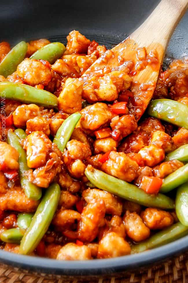 up close of simple Hoisin Chicken in a skillet with a serving spoon