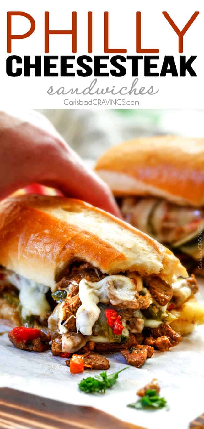 up close of Best Philly Cheesesteak recipe with a hand holding the Philly Cheesesteak witht steak and peppers falling out