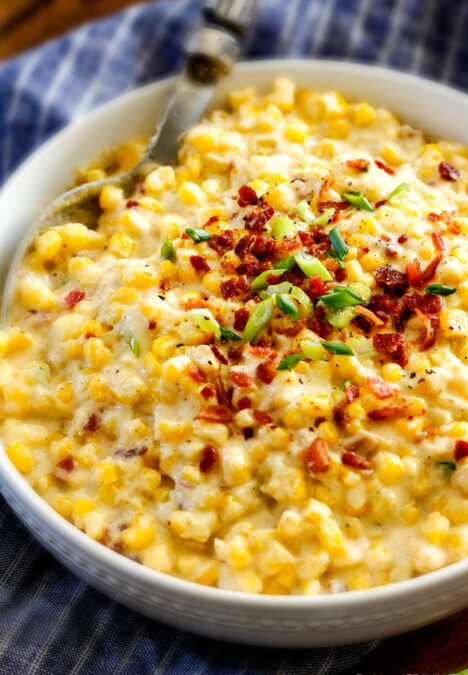 Slow Cooker Creamed Corn with Ricotta and Bacon - this has to be the BEST CREAMED CORN I've eaten in my entire life! Rich and creamy, seasoned to perfection, SO easy and practically fool proof! Definitely making this every Thanksgiving from now on!