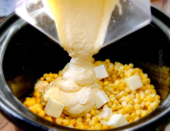 showing how to make creamed corn with cream cheese by adding purreed corn, cream cheese, heavy cream to slow cooker with butter