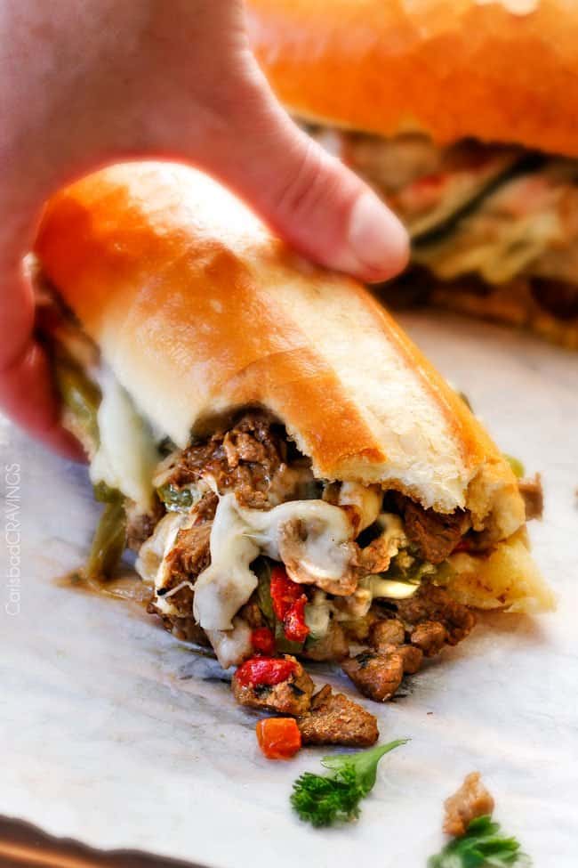 up close of Philly Cheesesteak sandwich with a bite taken out
