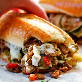 these crazy tender, flavorful Philly Cheesesteak Sandwiches are the BEST EVER! The incredible marinated steak and spiced mayo set these worlds above other recipes I've tried. You seriously haven't tried Philly Cheesesteak Sandwiches until you try these - and so much easier than you think!