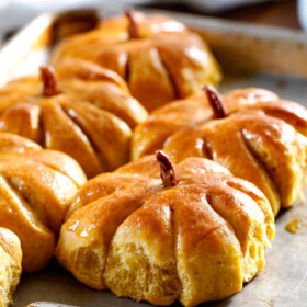 Fluffy, soft and tender Pumpkin Rolls will be the talk of your Thanksgiving Table! Adorably delicious and easier than you might think!