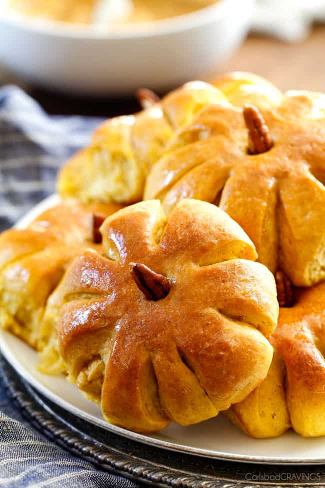 Fluffy, soft and tender Pumpkin in Dinner Rolls will be the talk of your Thanksgiving Table! Adorably delicious and easier than you might think!