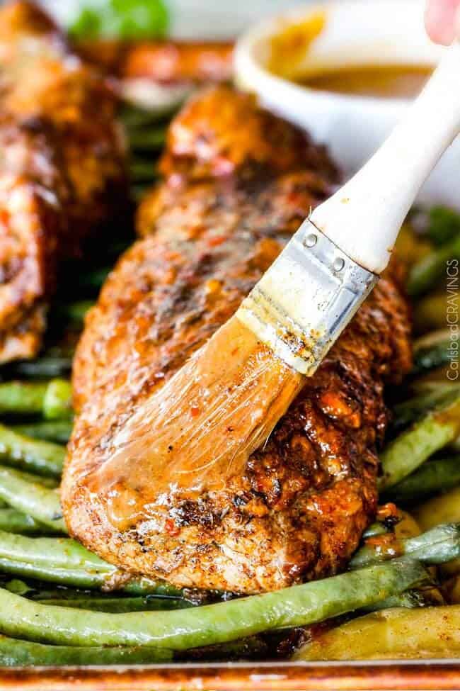 Close up of Pork Tenderloin being brushed. 