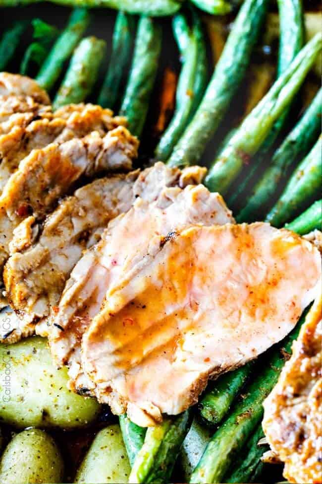 Sliced Pork Tenderloin on green beans.