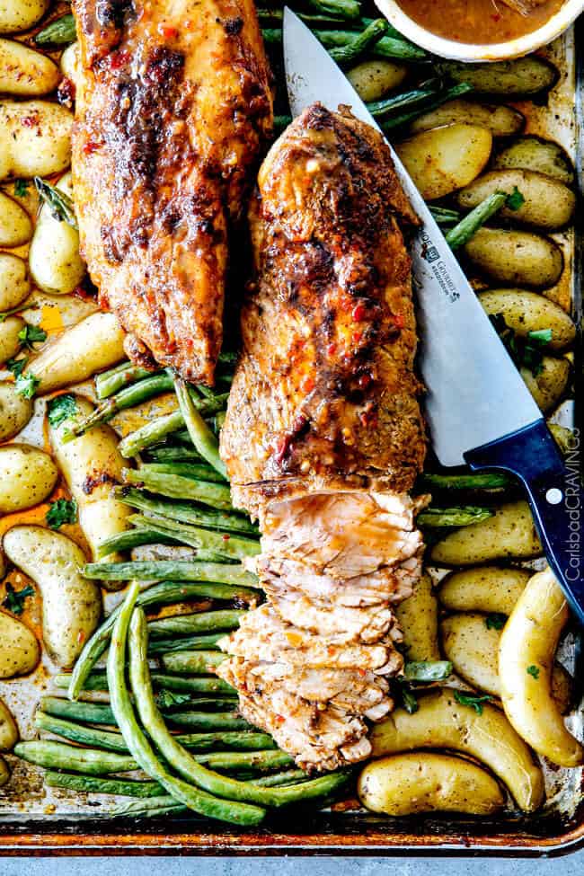 Sheet Pan Chili Dijon Pork Tenderloin with Green Beans and Potatoes all baked on ONE PAN! This is the most tender pork I have ever had and the tangy sweet and spicy flavors are out of this world!