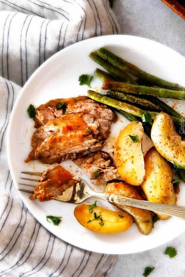 Pork Tenderloin on a plate with vegetables. 