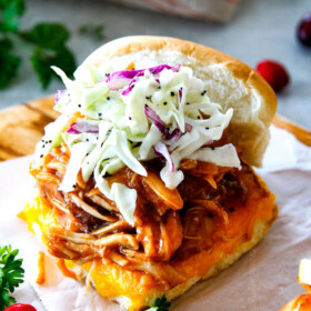 Chipotle BBQ Cranberry Turkey Sliders (or chicken!) are a wonderfully delicious way to devour your Thanksgiving turkey leftovers or SO good you will want to make them forever and ever with chicken! And don’t skip the crunchy, sweet and tangy out of this world Apple Poppy Seed Slaw!