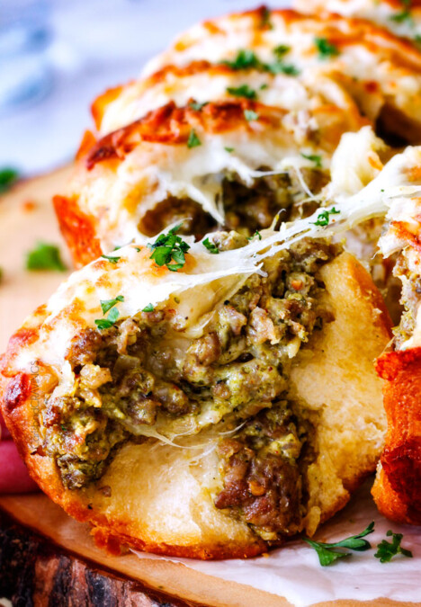 Easy Cheesy Pesto Sausage Ring is SO ADDICTING! my husband and I couldn't stop eating it and then I was craving it for days! You have to make this!!! The absolutely best holiday or game day appetizer!