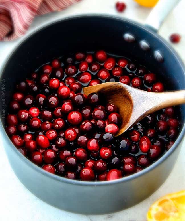 Pineapple Cranberry Sauce in a sauce pan being reduced. 