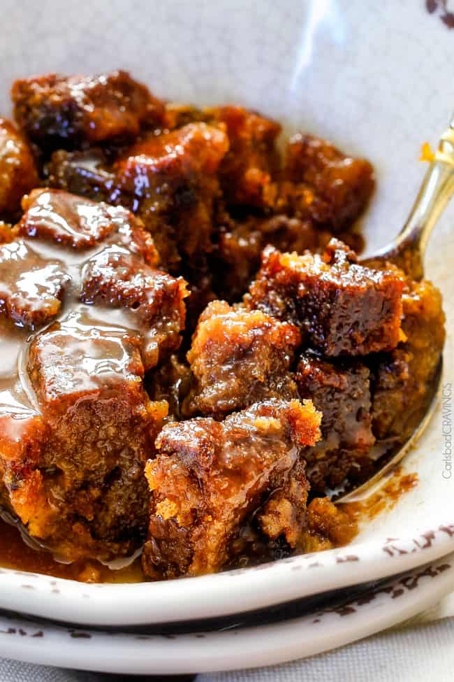 showing how to serve pumpkin bread pudding by pouring caramel over top and eating in a bowl with a spoon