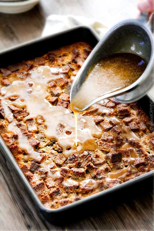 showing how to make pumpkin bread pudding by pouring caramel sauce over baked pumpkin bead pudding