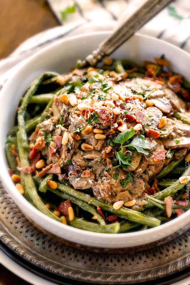 up close of a big white bowl of Roasted Green Beans with Bacon 