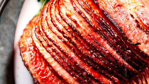 Baked Ham with Apple Cider Maple Glaze: beautifully caramelized, flavorful and deliciously moist baked ham takes minutes to prep and the glaze is out of this world! Perfect for Christmas, Easter and feeds a crowd!
