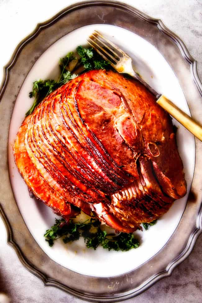 Maple Glazed Ham with on a white platter. 
