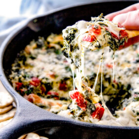 Brie Spinach Dip - my friends could not get over this appetizer! Its your favorite spinach dip made even more delicious with BRIE! Creamy, cheesy and so addicting!