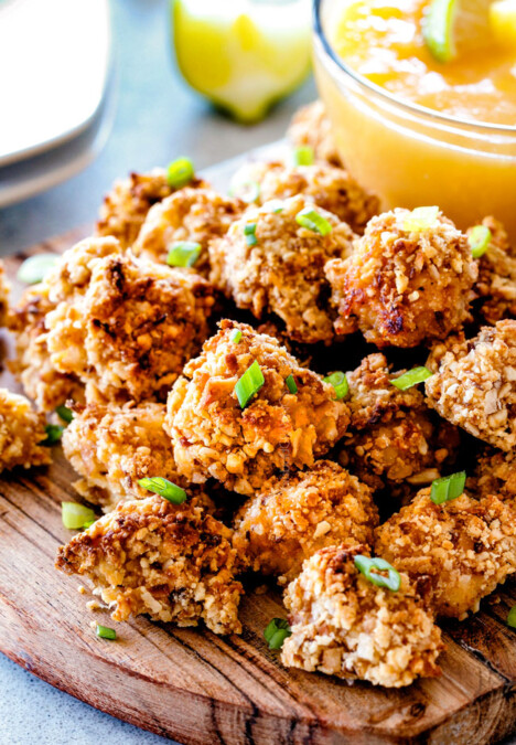 I am in LOVE with these BAKED COCONUT CASHEW CHICKEN BITES with sweet and tangy Pineapple Dip! Sweet and spicy, crunchy outside, tender inside and the flavor combo is dreamy! The BEST appetizer that everyone raves about! You seriously won't be able to stop eating them!