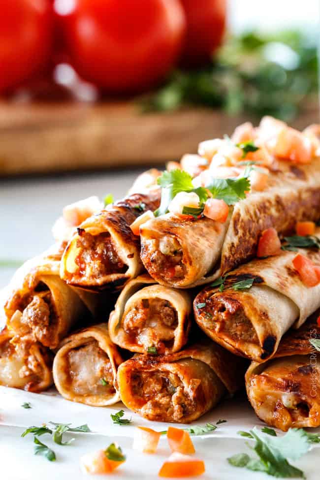 Side view of a stack of Jalapeno Popper Beef Taquitos.