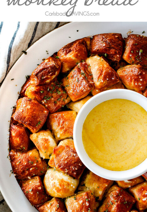 Soft, buttery Pretzel Monkey Bread with the most addicting Honey Mustard Dip! I always bring this crowd pleasing appetizer to parties and it is the first to go!
