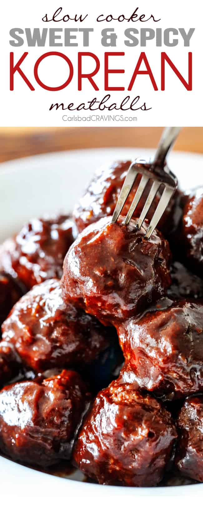 Korean Meatballs stacked on a white plate with a fork stabbing one of the meatballs