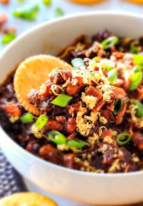 Super easy Boston Baked Bean Dip piled with bacon, cheese, sour green and green onions for your favorite sweet and tangy beans in savory scoop form! Always a crowd pleasing appetizer!