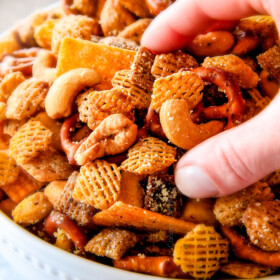 Make ahead crunchy, salty, savory Italian Parmesan Party Mix bursting with Italian flavor in each cashew, pretzel, chex mix bite! This is my go-to party snack that everyone begs me to make!