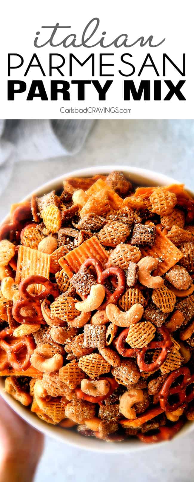 Make ahead crunchy, salty, savory Italian Parmesan Party Mix bursting with Italian flavor in each cashew, pretzel, chex mix bite! This is my go-to party snack that everyone begs me to make!