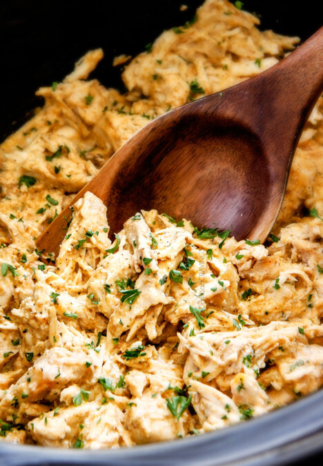 Slow Cooker Fiesta Ranch Cream Cheese Chicken is wonderfully creamy, seasoned to perfection and is as easy as dump and run! It makes the perfect make ahead filling for taquitos, tacos and burritos!