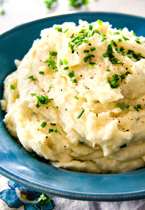 BEST EVER Creamy Company Mashed potatoes infused with butter, garlic, and Parmesan! I could eat these all day alone with a spoon - they are incredibly velvety, flavorful and so good everyone will beg you for the recipe!