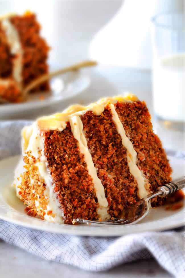 Layered Carrot Cake with Pineapple Cream Cheese Frosting - This is the BEST Carrot Cake Recipe, I will never make another recipe again! ! Super moist without being oily, spiced perfectly, and the Pineapple Cream Cheese Frosting is incredible! Brought this to a party and everyone was BEGGING me for the recipe!