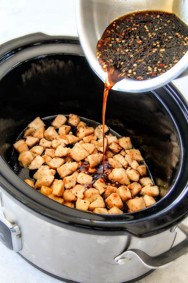 showing how to make Crock Pot Cashew Chicken by pouring the sauce in to the crockpot