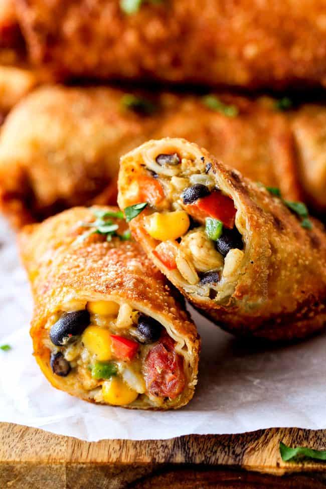 CRISPY Southwest Egg Rolls loaded with Mexican spiced chicken, beans, tomatoes, rice, avocado and cheese! These eggrolls are unreal! So much flavor and texture! And don't skip the Cilantro Lime Ranch Dip - its heaven!