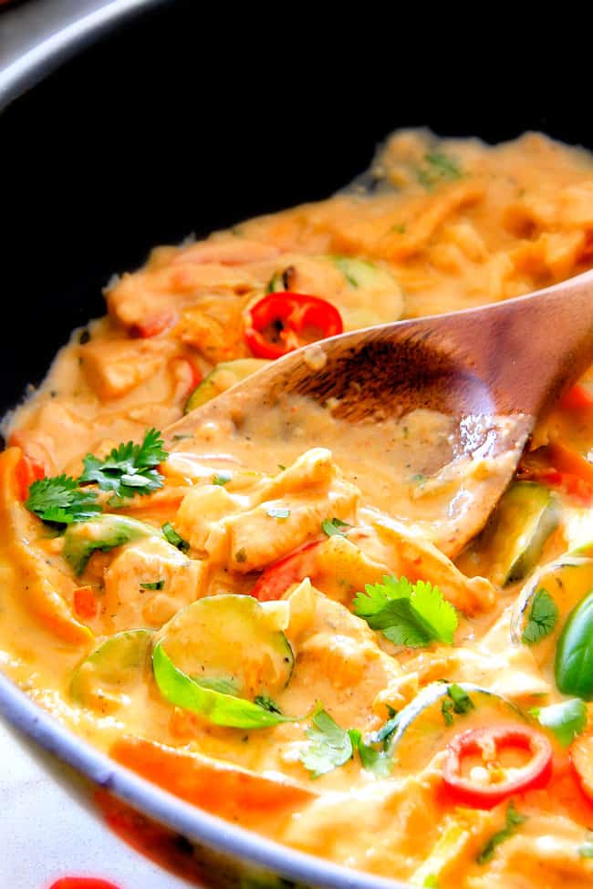 Close up of a Thai Red Curry Chicken in a black sauce pan.