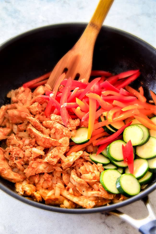 Showing how to make Thai Red Curry Chicken sauteing in a pan. 