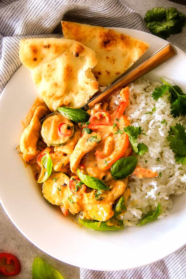 Thai Red Curry Chicken with rice on a plate. 