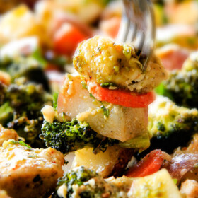 Sheet Pan Parmesan Pesto Chicken, Potatoes, Broccoli and Carrots bursting with flavor and SO EASY!! practically one pan prep making this ideal weeknight meal!