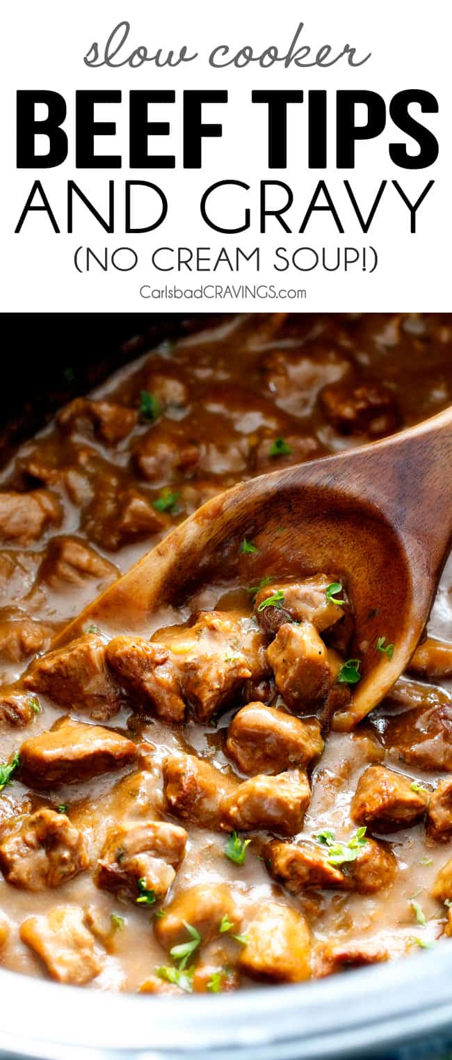 up close of Beef Tips Recipe in crock pot with a wooden spoon scooping beef