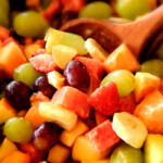 Strawberry Melon Fruit Salad with Creamy Citrus Glaze - I took this to a barbecue and it was gone in minutes! Its so cool and refreshing withe the BEST GLAZE and I love the combo of melons, strawberries, bananas, apples and grapes!