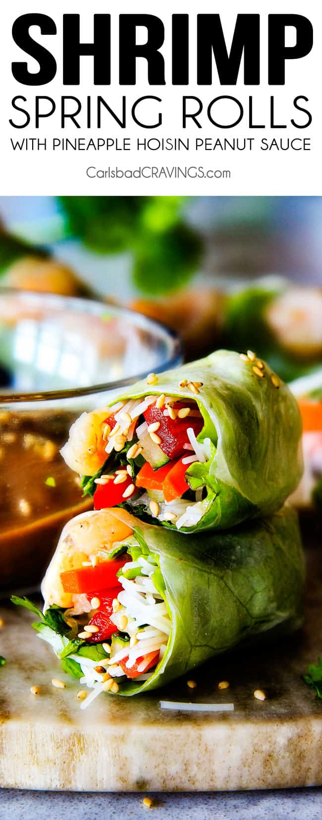 Vietnamese Spring Rolls cut in half and stacked on top of each other on a cutting board