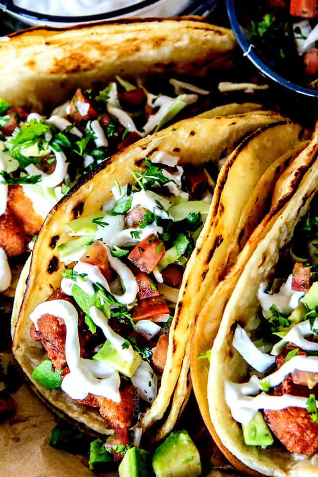 these Crispy fried Baja Fish Tacos are BETTER than any restaurant!!! I can't even believe how good these are and super easy with a one step batter. And don't skip the white sauce - its heavenly!