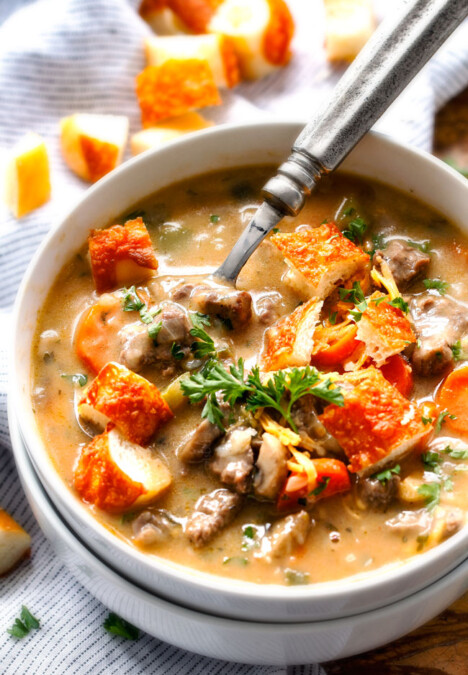 ONE POT Philly Cheesesteak Soup - My family LOVES this soup, we make at least twice a month! Its bursting with steak, peppers, onions, mushrooms in a flavor exploding cheesy soup all topped with cheesy seasoned croutons!