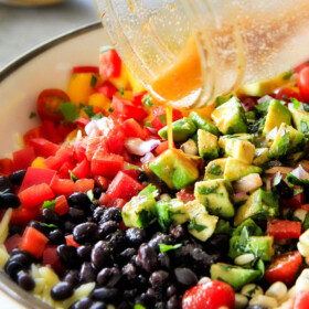 This Southwest Orzo Salad is SO good I was craving it for days! Its my new go-to potluck side loaded with mangoes, black beans, corn, peppers and avocado but the BEST part is the Chipotle Honey Lime Vinaigrette! And I love that you can make it ahead of time!