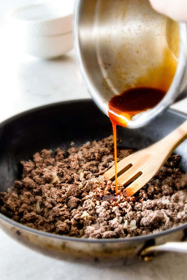 showing how to make easy Korean Beef Bowls with ground beef by adding Korean sauce to skillet with ground beef, onions, garlic and ginger