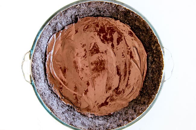 process shot showing how to assemble an oreo mud pie
