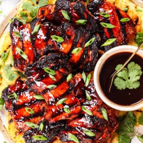 top view of serving Huli Huli Chicken recipe being on a platter garnished with green onions