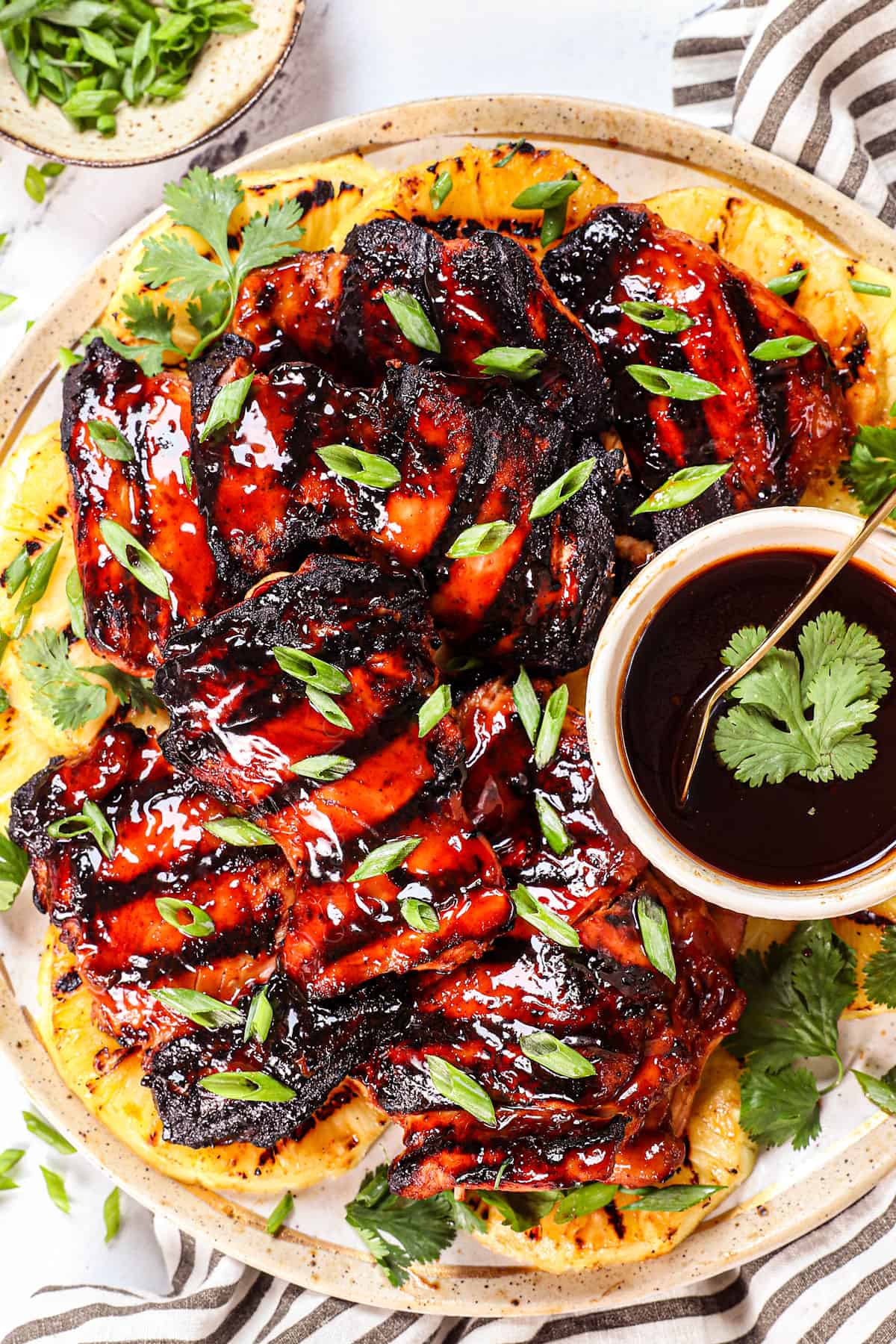 top view of serving Huli Huli Chicken recipe being on a platter garnished with green onions